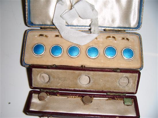 A set of 6 enamel dress studs and one other set of gold studs (2)